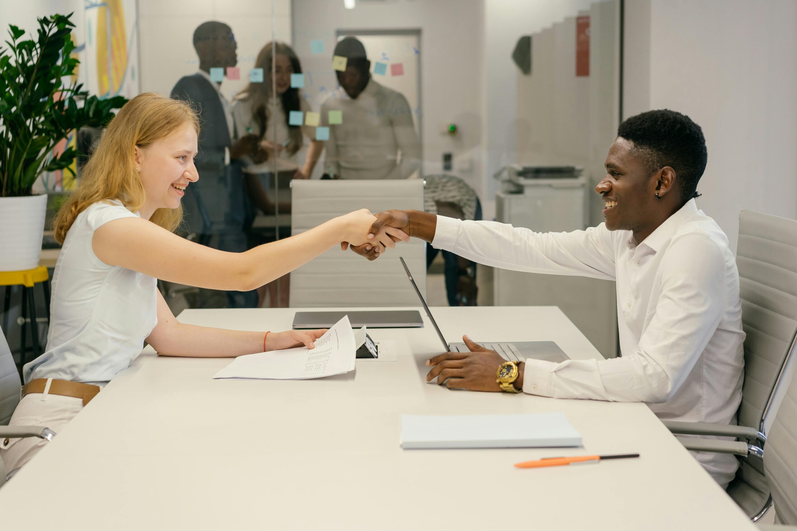 pexels-mikhail-nilov-9301879-scaled.jpg Free Business professionals completing a successful deal with a handshake in a modern office setting. Stock Photo
